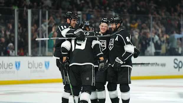 Jan 18, 2022; Los Angeles, California, USA; LA Kings center Anze Kopitar (11), LA Kings left wing Alex Iafallo (19), defenseman Mikey Anderson (44) and defenseman Drew Doughty (8) celebrate after a goal against the Tampa Bay Lightning in the second period at Crypto.com Arena. Mandatory Credit: Kirby Lee-USA TODAY Sports
